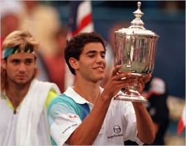 At 19, Sampras became the youngest ever winner of the US Open. Agassi (with hair) looks appalled